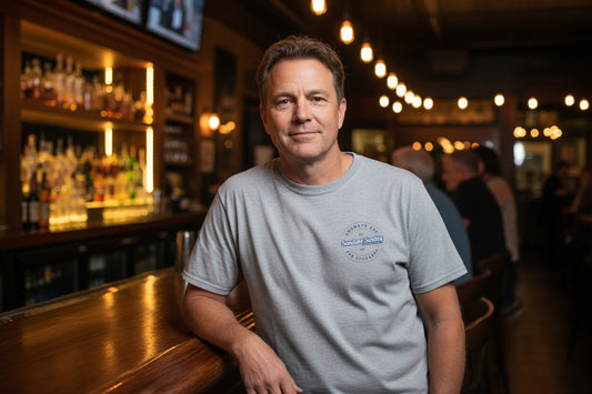 Gray t-shirt with a logo on the chest against a white background